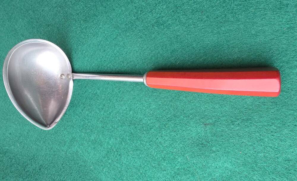 Vintage Corona Ladle tear drop shape with red Bakelite handle.